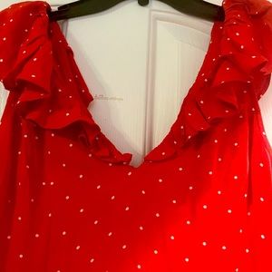 Women’s size medium , red/ white dress with ruffle neckline .